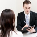 a young businessman talking to women