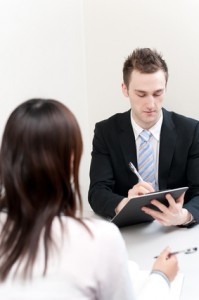 a young businessman talking to women